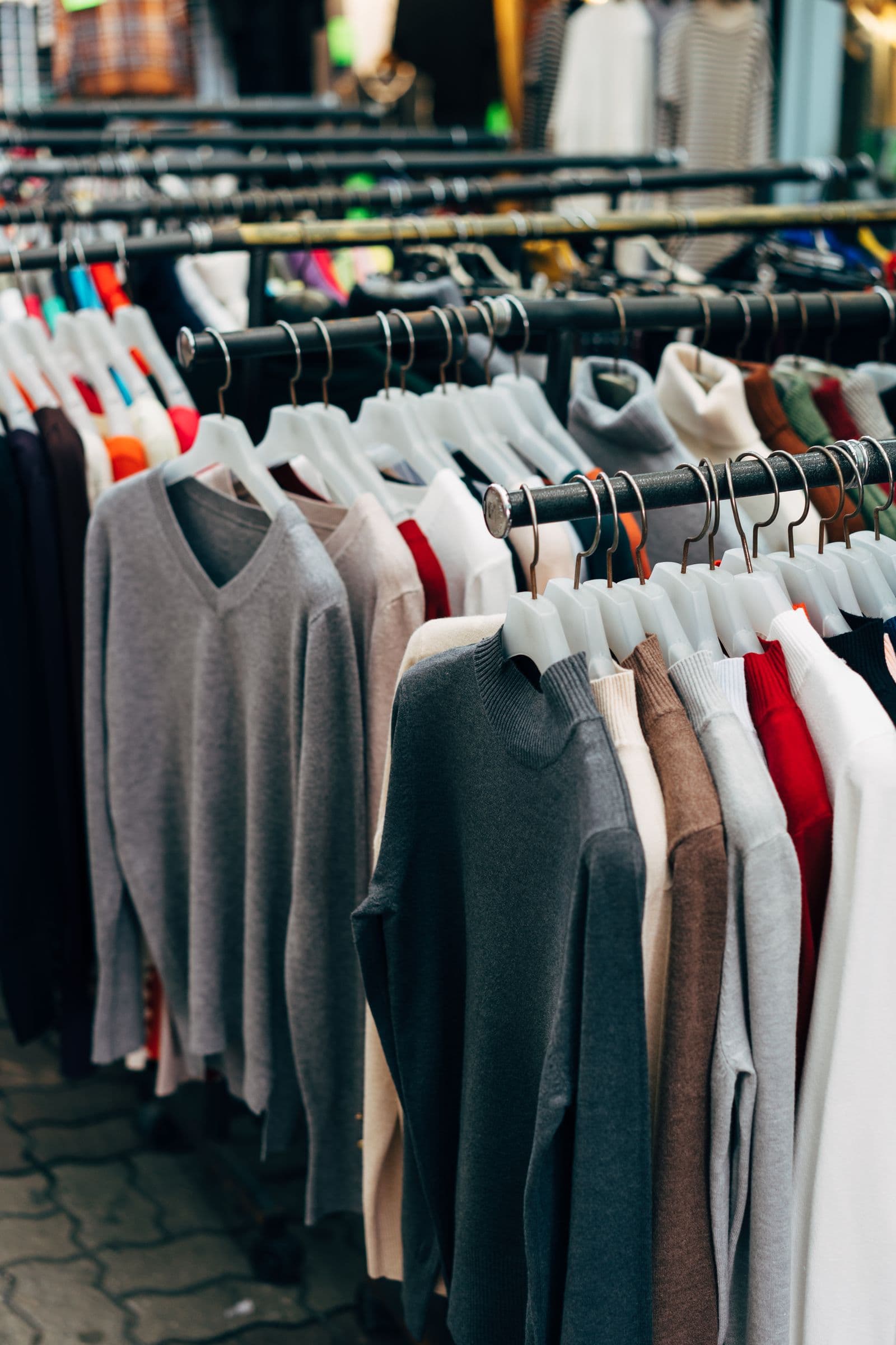 Clothing displayed on racks inside a retail store